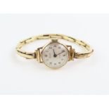 A ladies Avia watch face with 9ct gold case, on a