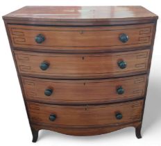 A Victorian mahogany and ebonised bow front chest