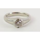 A platinum diamond solitaire ring, the rub over se