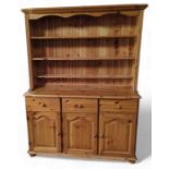 A contemporary orange pine dresser, 183cm, 133cm,