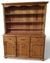 A contemporary orange pine dresser, 183cm, 133cm,