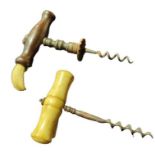 A 19th Century corkscrew with shaped wood handle f