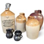 Four 19th century stoneware flagons including A.J