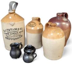 Four 19th century stoneware flagons including A.J