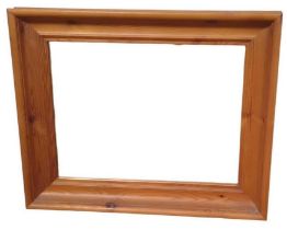 A contemporary pine wall mirror