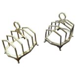 A pair of silver five-division toast racks, by Per