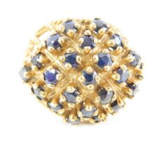 An unusual 9ct gold sapphire set bombe style ring,