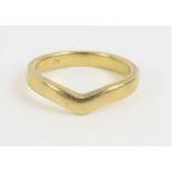 A 9ct gold shaped wedding band, finger size K 1/2,