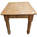 A rectangular pine table fitted with single drawer