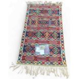 A hand woven Kilim wall hanging