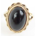 A 9ct gold black onyx dress ring, finger size L 1/