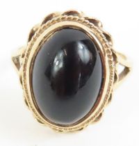 A 9ct gold black onyx dress ring, finger size L 1/