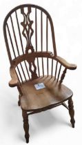 A pine windsor armchair, 117cm, 64cm, 46cm