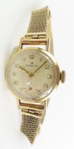 A ladies 9ct gold Zenith wrist watch on mesh link