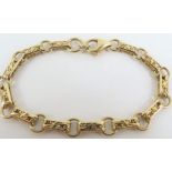 An unmarked gold bracelet, with mixed links, the r