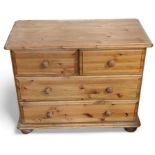 A contemporary orange pine bachelors chest of draw