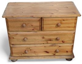 A contemporary orange pine bachelors chest of draw