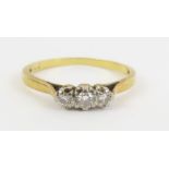 An 18ct gold diamond three stone ring, finger size