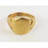 An 18ct gold signet ring, with shield shaped head,