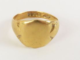 An 18ct gold signet ring, with shield shaped head,