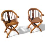 A pair of contemporary Chinese hardwood armchairs,
