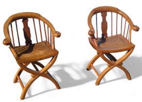 A pair of contemporary Chinese hardwood armchairs,