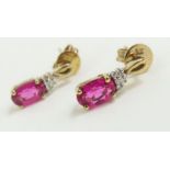 A pair of ruby and diamond stud earrings,