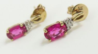 A pair of ruby and diamond stud earrings,