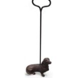 A cast bronze door stop modelled in the form of a