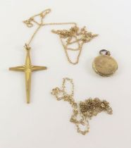 A 9ct gold cross; two chains indistinctly marked '