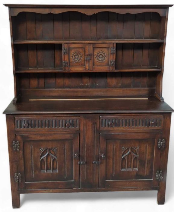 An Ercol/Old Charm elm dresser, with cupboards and