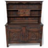 An Ercol/Old Charm elm dresser, with cupboards and