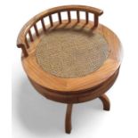 A hardwood circular occasional table, with single