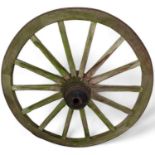 A weathered wagon wheel, 117cm diameter