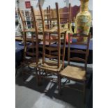 A set of five beech ladder back chairs with rush s