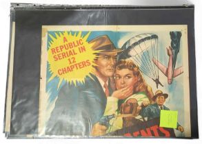 A collection of vintage film posters includes I, J