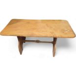 A pine refectory dining table, with stretcher belo