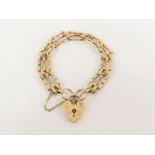 A 9ct gold three bar gate bracelet, with twisted l