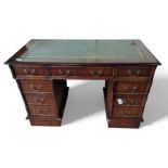 A reproduction twin pedestal desk, with tooled leather top