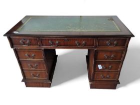 A reproduction twin pedestal desk, with tooled leather top