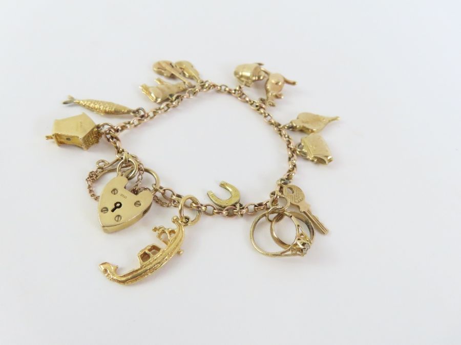 A 9ct gold belcher link charm bracelet, with vario