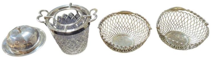 A pair of silver metal wire breadbaskets with swi