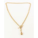 A 9ct gold T-bar necklace, with puff heart charm,