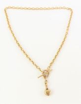 A 9ct gold T-bar necklace, with puff heart charm,