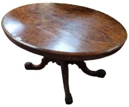 A Victorian burr walnut oval tilt top breakfast ta