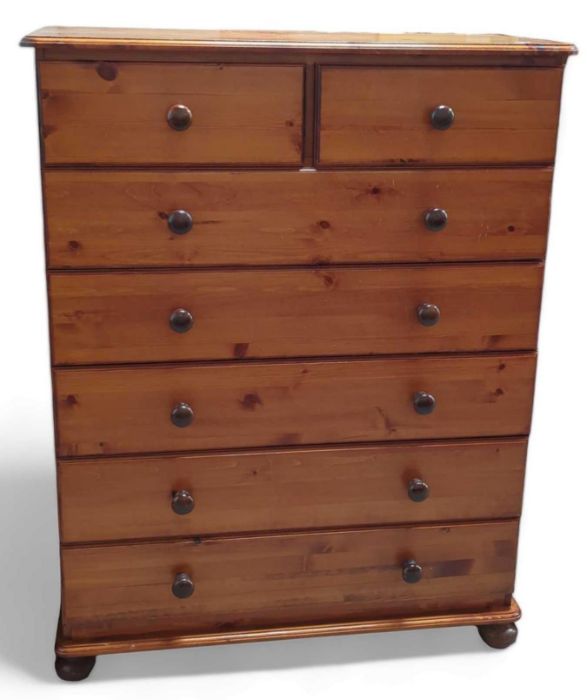 A contemporary stained pine chest of drawers, 89cm