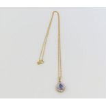 A 9ct gold synthetic blue spinel and diamond penda