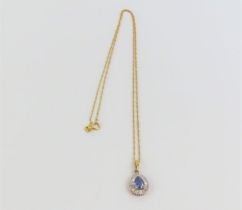 A 9ct gold synthetic blue spinel and diamond penda