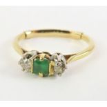 An early 20th century emerald and diamond three st