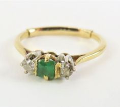 An early 20th century emerald and diamond three st